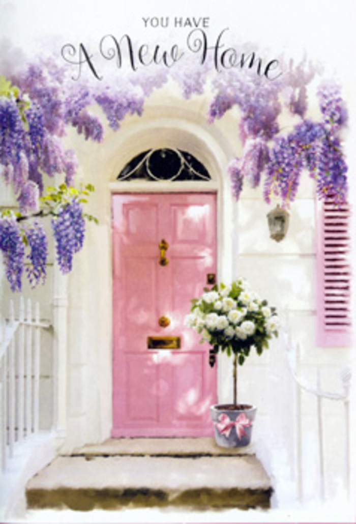 A romantic entranceway in Keston is transformed into a scene of understated celebration, with wisteria tumbling overhead in lilac and lavender strands that sway gently above a pastel pink front door. The door's colour is playful yet soothing, a powdery rose that stands out softly against whitewashed walls, like something you might discover while wandering the paths near Keston Common on a bright spring afternoon. A matching shutter, painted in the same tender blush, leans open to one side, letting sunlight pour through and cast a patchwork of soft shadows across the doorstep. Nestled on the stone step is a simple grey tin bucket, the kind a florist might favour for its clean lines and rustic charm. It brims with velvety white roses, their generous petals layered in creamy spirals. The blooms are arranged thoughtfully so that some face upwards to the light while others tilt outward, ready to greet whoever approaches. Threads of pale green foliage weave through the arrangement, lending a touch of movement and the impression of fresh-cut stems gathered from a garden just beyond view. Around the bucket's base, a satin ribbon in delicate pink is tied into a loose, flowing bow, its ends draping over the rim like a finishing flourish. The imagined scent is a mixture of powdery wisteria and fresh rose petals, hanging quietly in the warm air. Visually, the scene expresses encouragement and calm, the perfect floral moment for congratulating someone on their new Keston home, easing any first-day nerves, and filling their threshold with beauty, warmth, and the comforting feeling that they have truly arrived.
