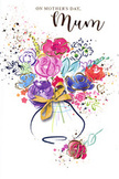 This Mother's Day card features a jubilant watercolour bouquet that seems to leap from the page, full of colour, texture, and tender feeling. The flowers are rendered in loose, expressive strokes: lush magenta and cerise blossoms mingle with velvety patches of purple and indigo, while hints of soft peach, coral, and warm pink create gentle transitions between the deeper tones. Cool blues and lavender notes float in between, offering a calming counterpoint, much like the peaceful streets surrounding Keston's leafy commons. Fine highlights of gold shimmer along selected petals and leaves, and occasionally trail into the background, suggesting the glint of sunlight on fresh blooms about to be delivered to a doorstep off Heathfield Road. The background remains mostly white, which allows the colours to breathe; playful splatters, heart shapes, and paint droplets scatter outward from the bouquet, giving the impression of petals tossed in celebration or confetti in the air. At the bottom, the flowers gather into a soft, curving vase, finished with a delicate golden bow that evokes the sound of ribbon being tied in a local Keston flower shop. The overall impression is one of affectionate exuberance, like a hug translated into paint. It feels as though a florist has taken the essence of a hand-tied bouquet and captured it in a single, joyful image, perfect for expressing love, thanks, and admiration to a much-loved mum on Mother's Day.